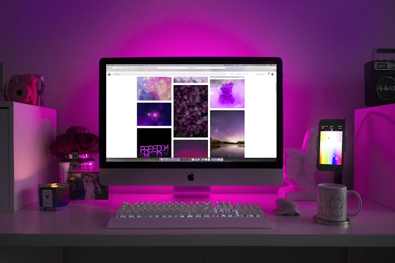 Web developer coding on split monitors
